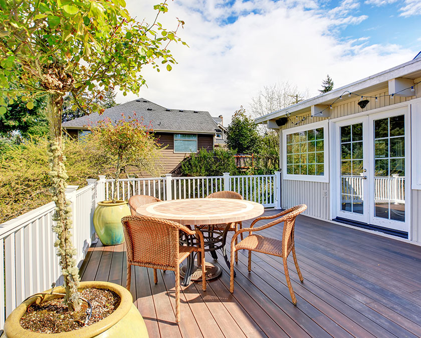 Dark stained deck with white railing