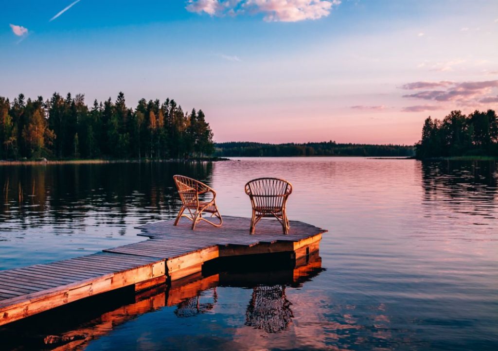 dock on a lake at sunset