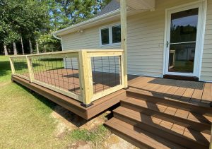 smaller deck with wooden railing