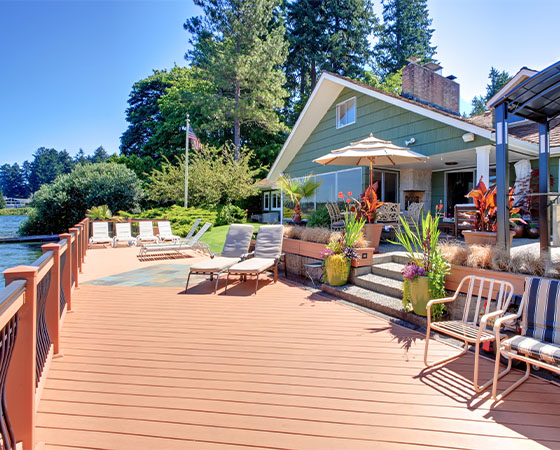 beautiful dock with lounge chairs and tables