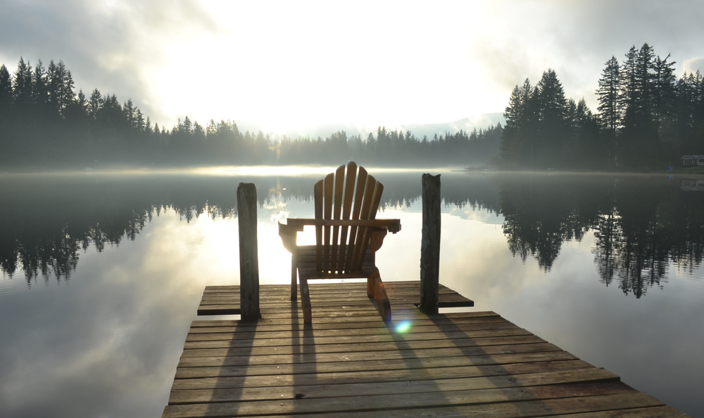 Chair on Dock at a Lake in Late Afternoon