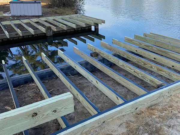 a deck on water being repaired