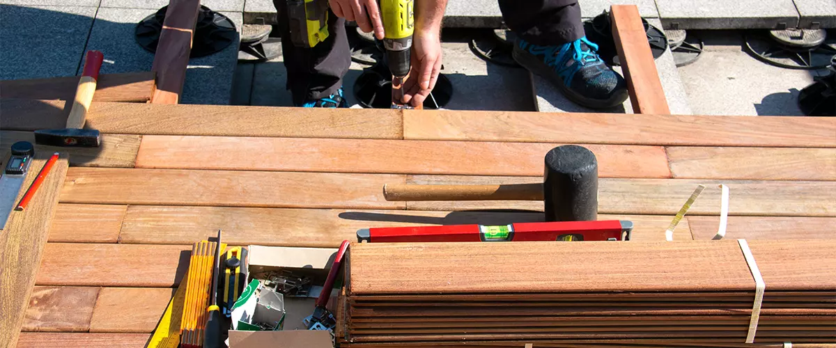 A Technician working on deck repair in Holly Springs, NC
