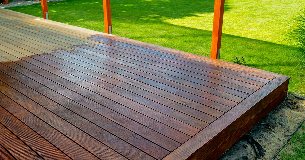 Close-up of a wooden deck - on the covered terrace - showing the process of restoration